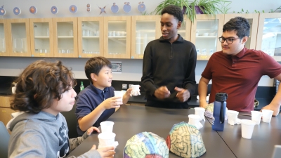Fostering Collaboration: High School Science Class Welcomes Elementary Students for Hands-On Learning